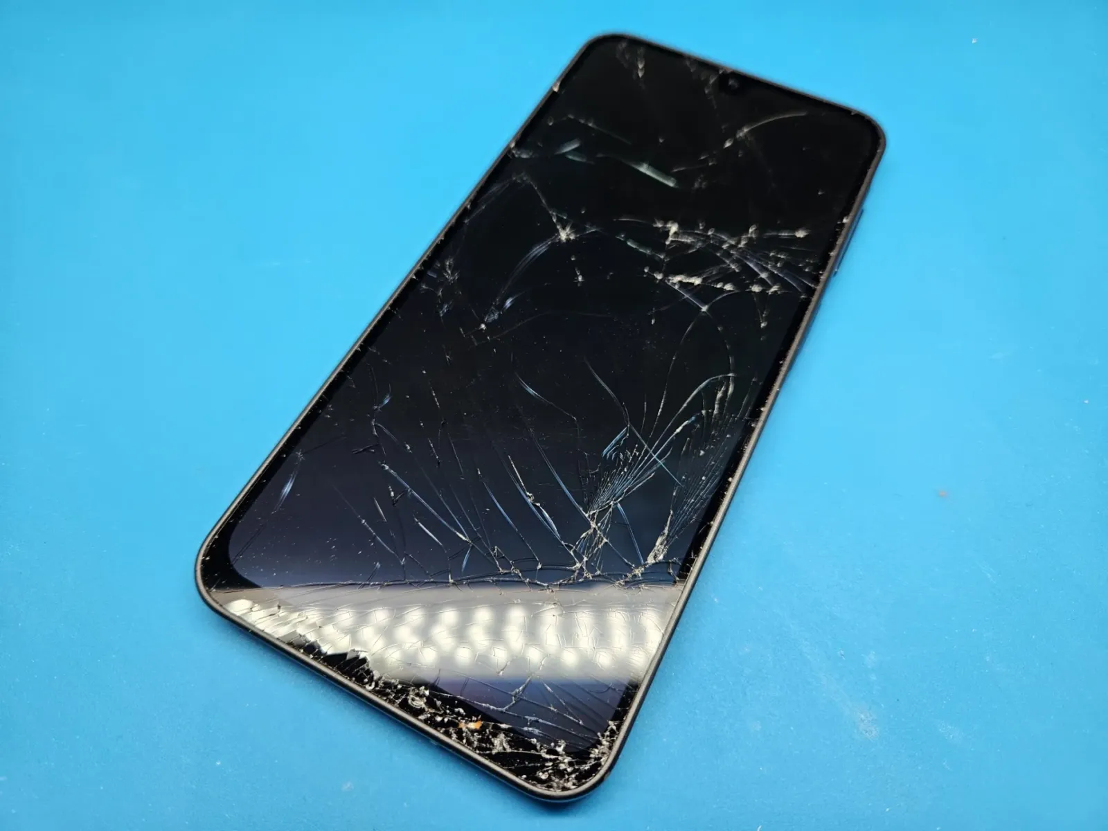 A Samsung Galaxy A17 with a smashed screen in for repair