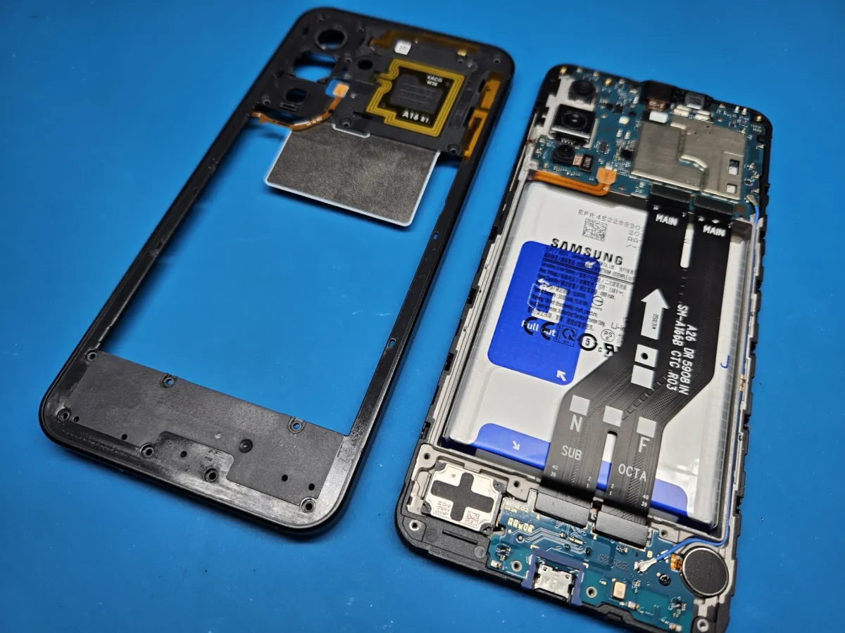 Inside a Galaxy A17 with the inner cover removed, showing the battery and flex cables
