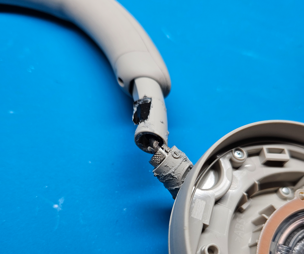 Sony WH-1000XM5 with a snapped headband hinge, opened for repair on my bench
